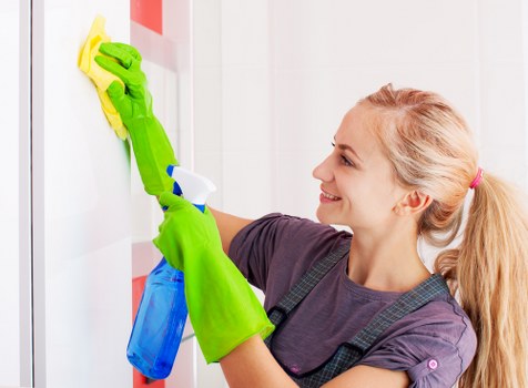 Professional carpet cleaner in Brixton restoring a living room carpet