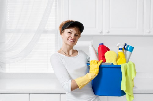 Oven cleaning specialist preparing a safe Brixton kitchen work area